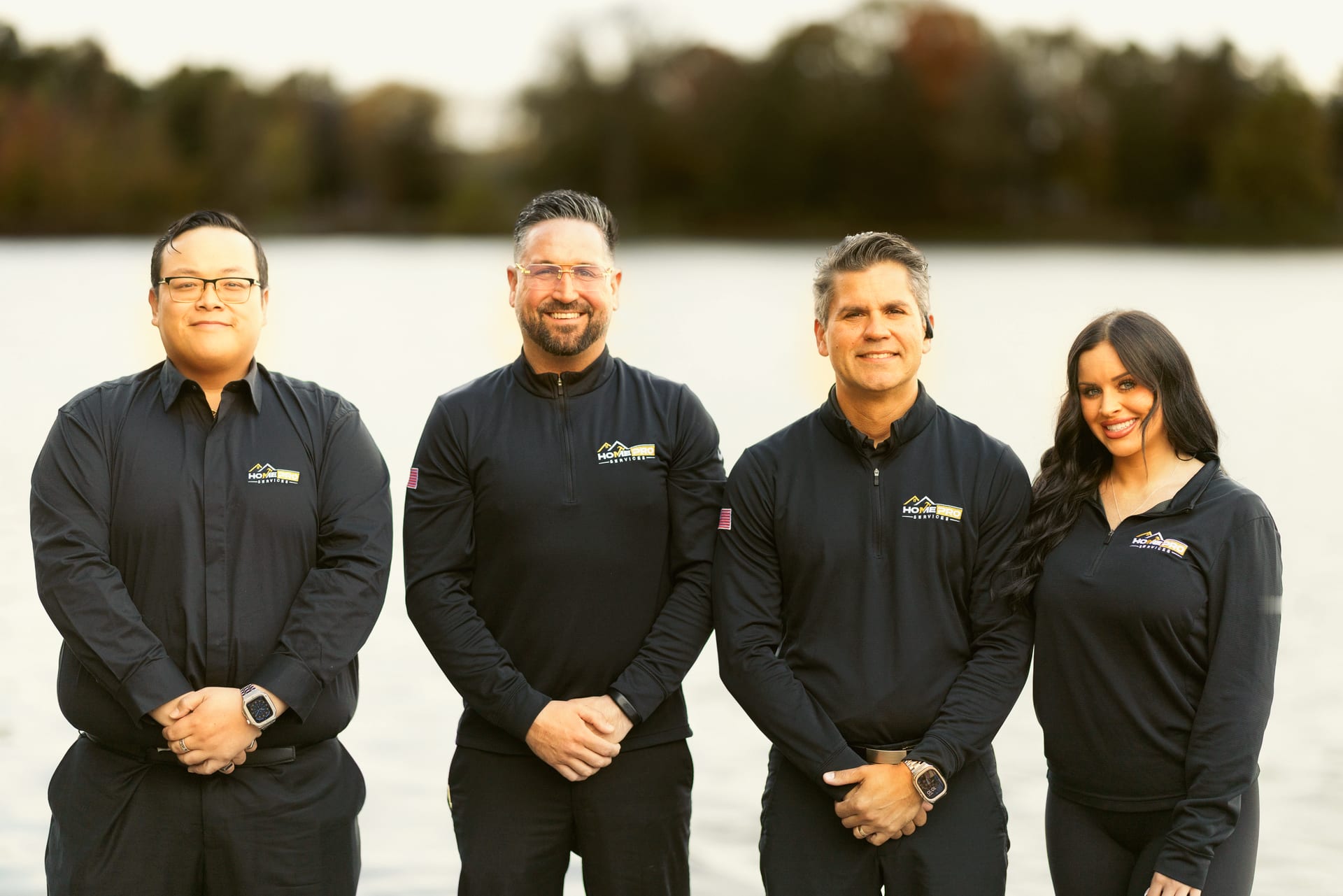 The HomePro crew: Tayler, Lourenzo and the team on a dock at a Michigan lake