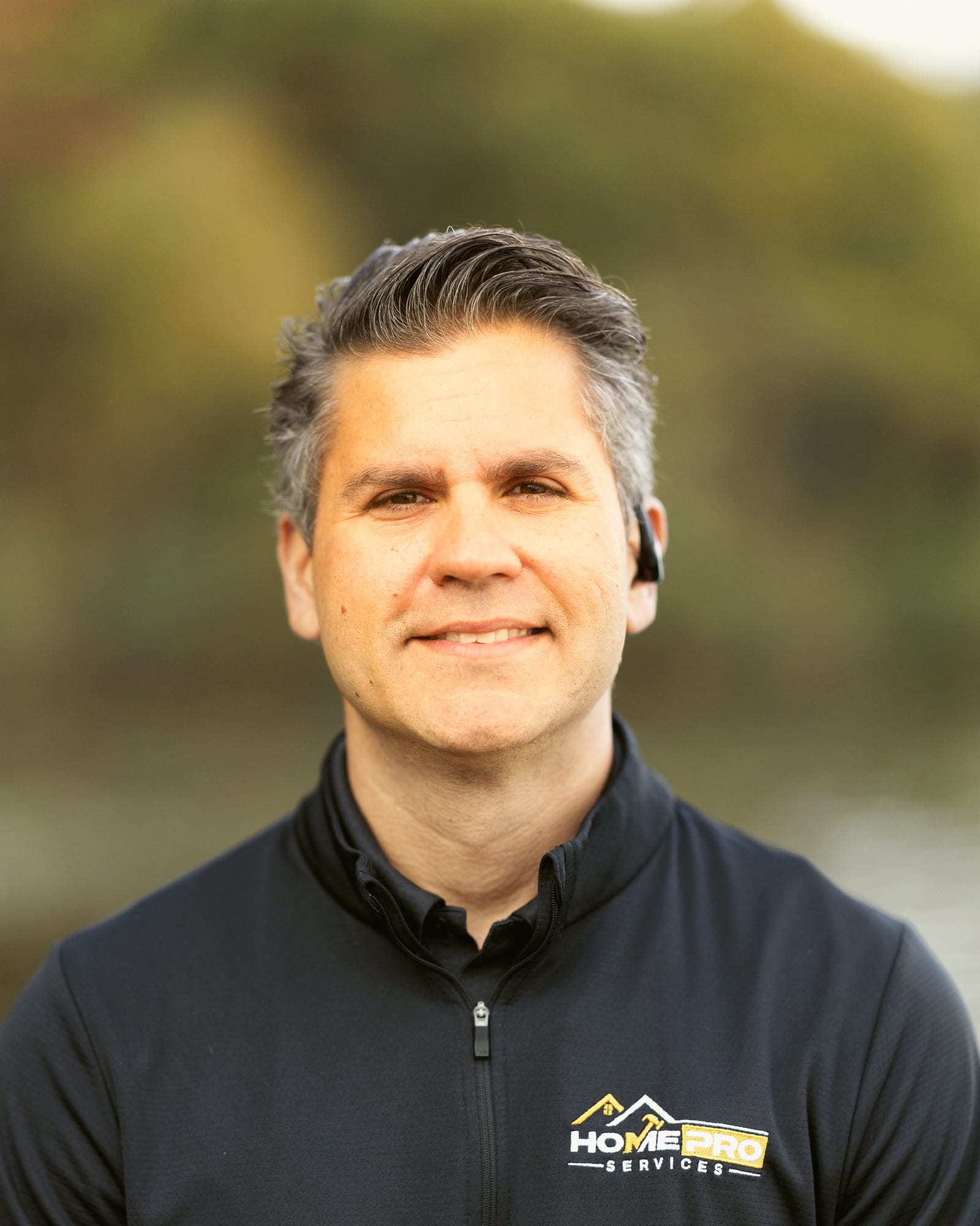 Lourenzo Da Silva, owner and President of HomePro Services, by a Michigan lake